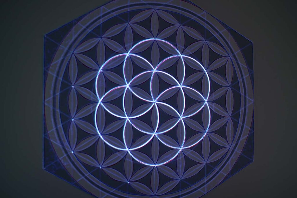 Flower of Life painting with projection illuminating the flower of life pattern